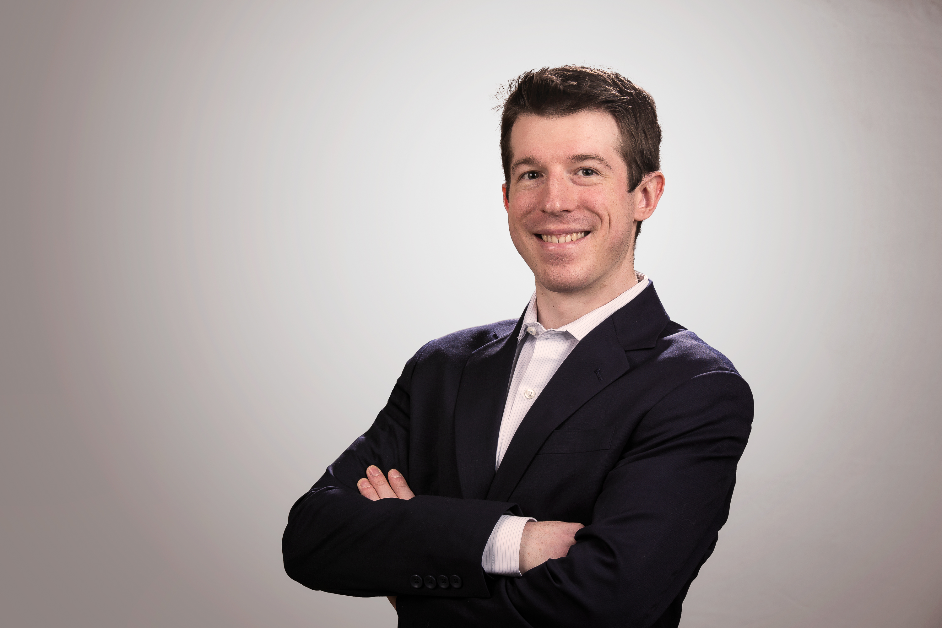 Studio-lit light professional photo of a young business man